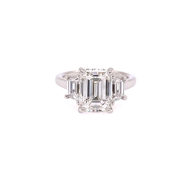 Platinum Emerald Cut Diamond Ring with Step-Cut Trapezoid Side Stones