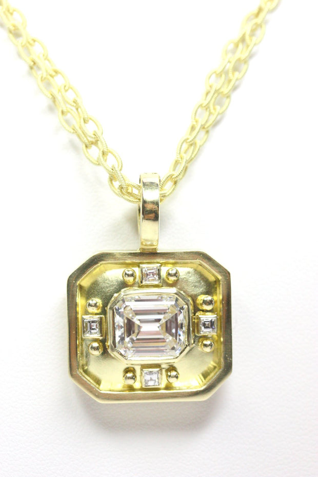 18kt yellow gold and diamond emerald cut pendant