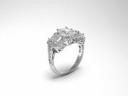 Platinum Three Stone Emerald Cut Ring with Round Diamond Halo