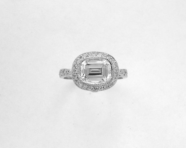 Platinum Emerald Cut Diamond Ring with Round Diamond Halo