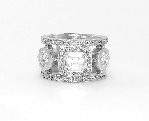 Platinum Emerald and Round Cut Diamond Ring