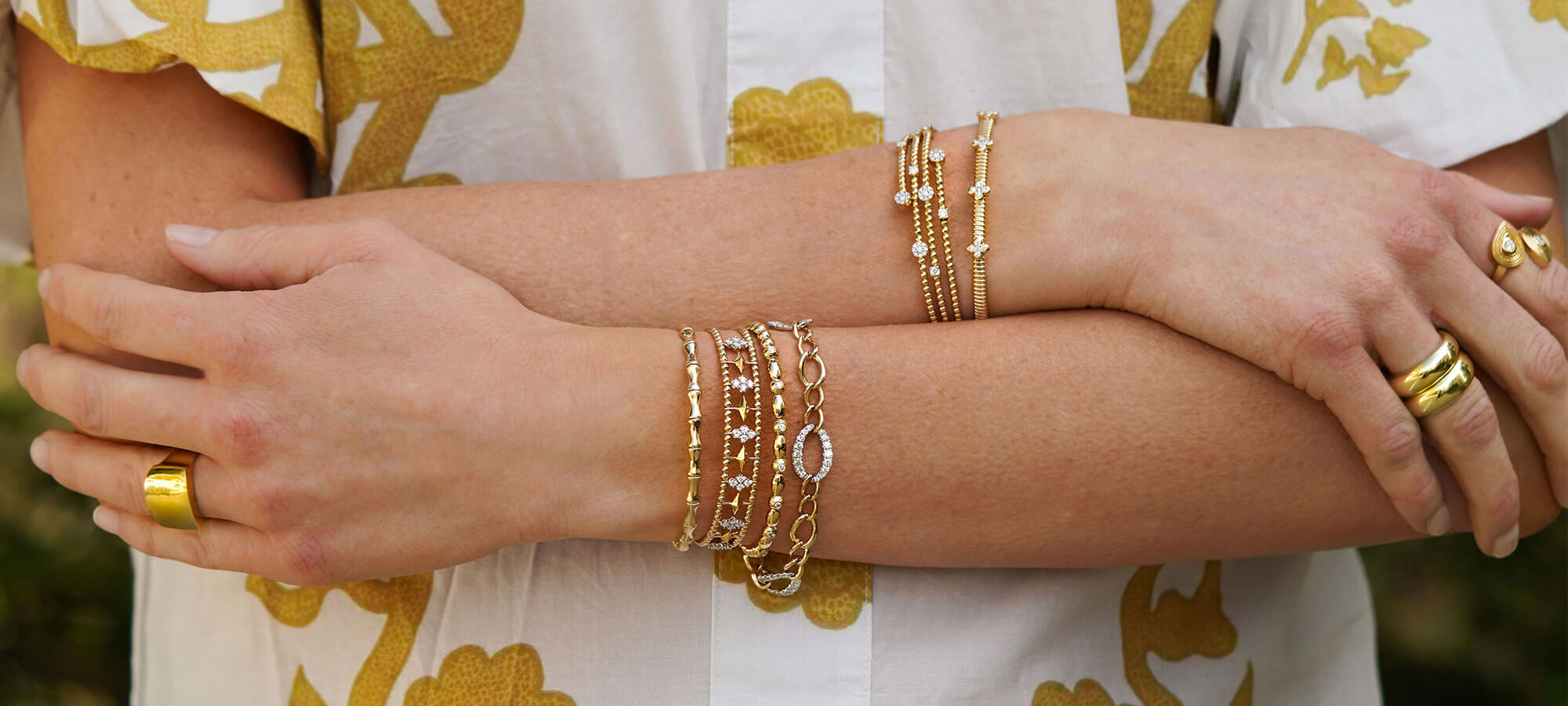 woman wearing bracelets designed by Gabriel & Co.