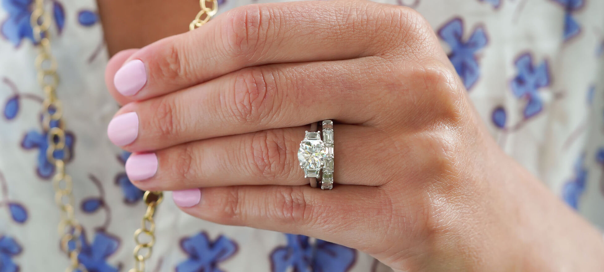 woman wearing three custom designed engagement rings
