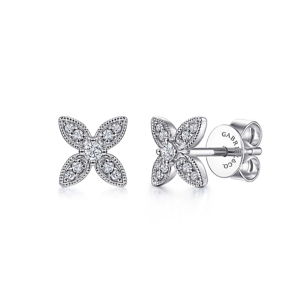 A pair of 14K white gold and diamond flower stud earrings designed by Gabriel & co.