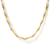 A 14K yellow gold necklace with a bamboo-inspired segmented design, accented with small round clear diamonds at intervals, shown on a clean white background.