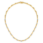 A 14K yellow gold tennis necklace featuring small round-cut diamonds set along the chain, displayed on a clean white background.