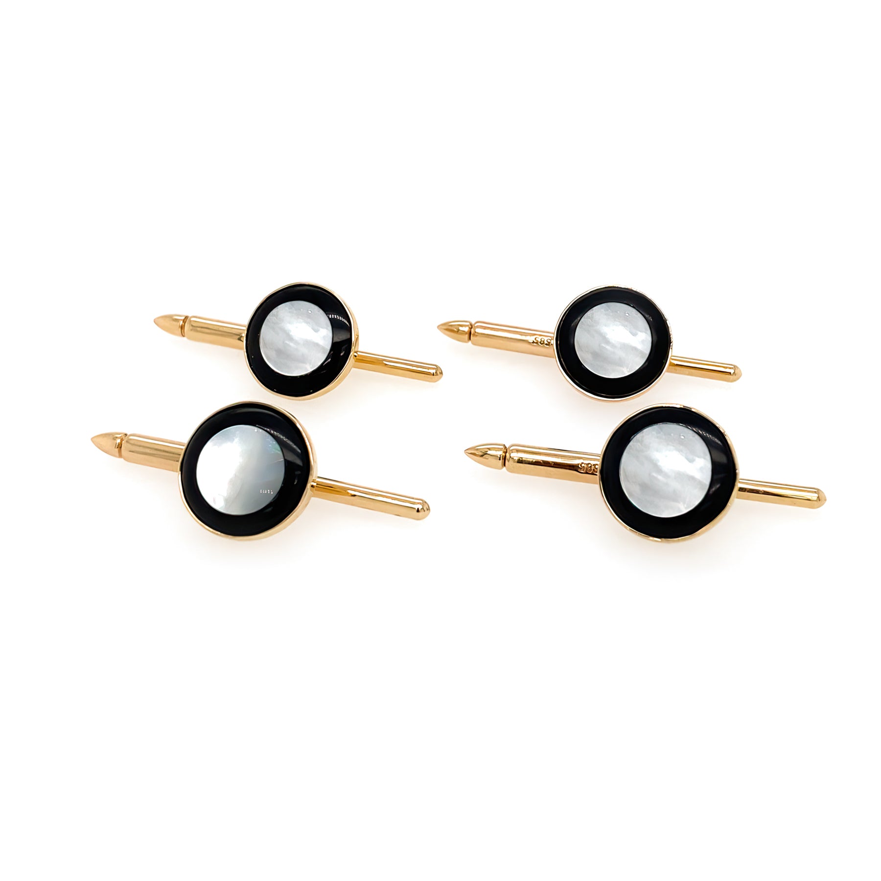 A set of four 14K gold studs with mother of pearl and onyx inlays.