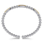 Bracelet with sterling silver beads and 14k gold bars on a white background