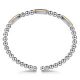 Bracelet with sterling silver beads and 14k gold bars on a white background