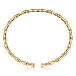 A 14K gold open cuff bracelet designed to look like a segmented bamboo stalk, shown on a clean white background.
