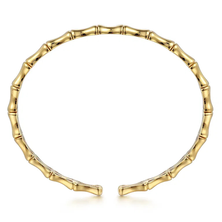 A 14K gold open cuff bracelet designed to look like a segmented bamboo stalk, shown on a clean white background.