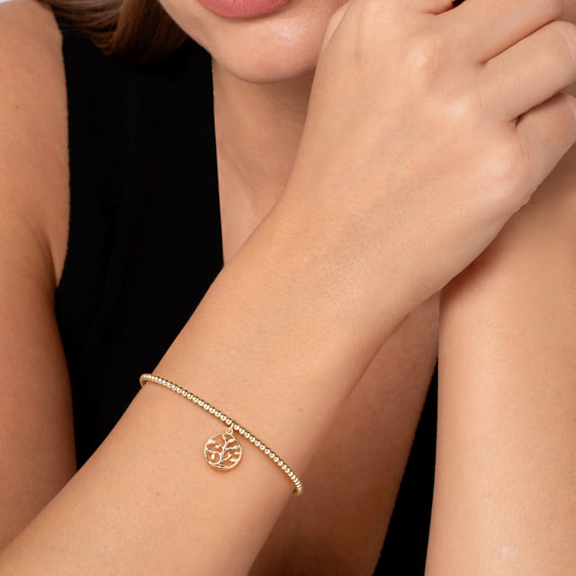 14k yellow gold bangle bracelet on wrist