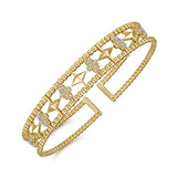 14K Gold bracelet with geometric designs and diamonds on a white background