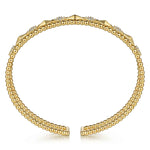 14K Gold bracelet with geometric designs and diamonds on a white background