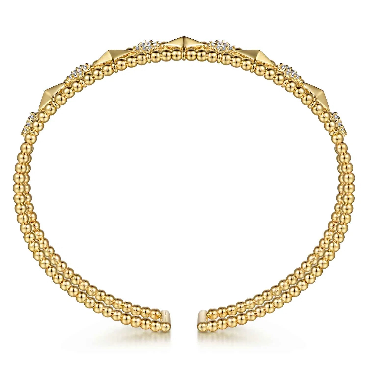 14K Gold bracelet with geometric designs and diamonds on a white background