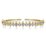 A 14K yellow gold cuff bracelet featuring a central row of clear pavé-set diamonds and multiple pointed spike accents on both sides, shown on a plain white background.