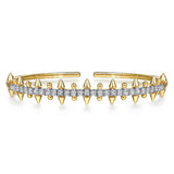 A 14K yellow gold cuff bracelet featuring a central row of clear pavé-set diamonds and multiple pointed spike accents on both sides, shown on a plain white background.