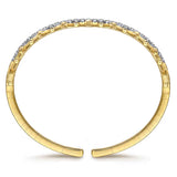 A 14k Yellow Gold open cuff bracelet featuring a row of clear diamonds along the top curve, set against a plain white background.