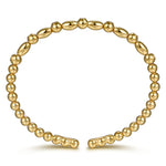 A 14K gold beaded bracelet with alternating smooth oval beads and smaller round beads, displayed on a clean white background.