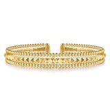 A 14K gold cuff bracelet featuring multiple rows of polished Bujukan beads and pyramid-shaped textured details, displayed on a clean white background.