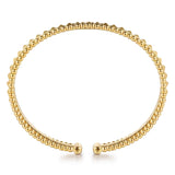 A 14K gold beaded cuff bracelet with a tapered, pyramid-like pattern and a split clasp design at the ends, shown on a clean white background.