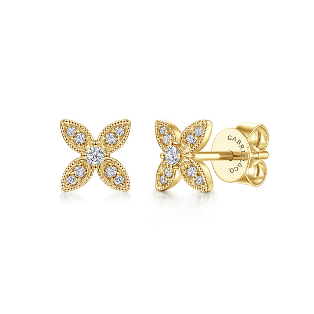 14KGold flower-shaped earrings with diamonds on a white background