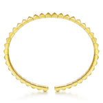 A 14K gold open cuff bracelet designed by Gabriel & Co