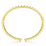 A 14K gold open cuff bracelet designed by Gabriel & Co