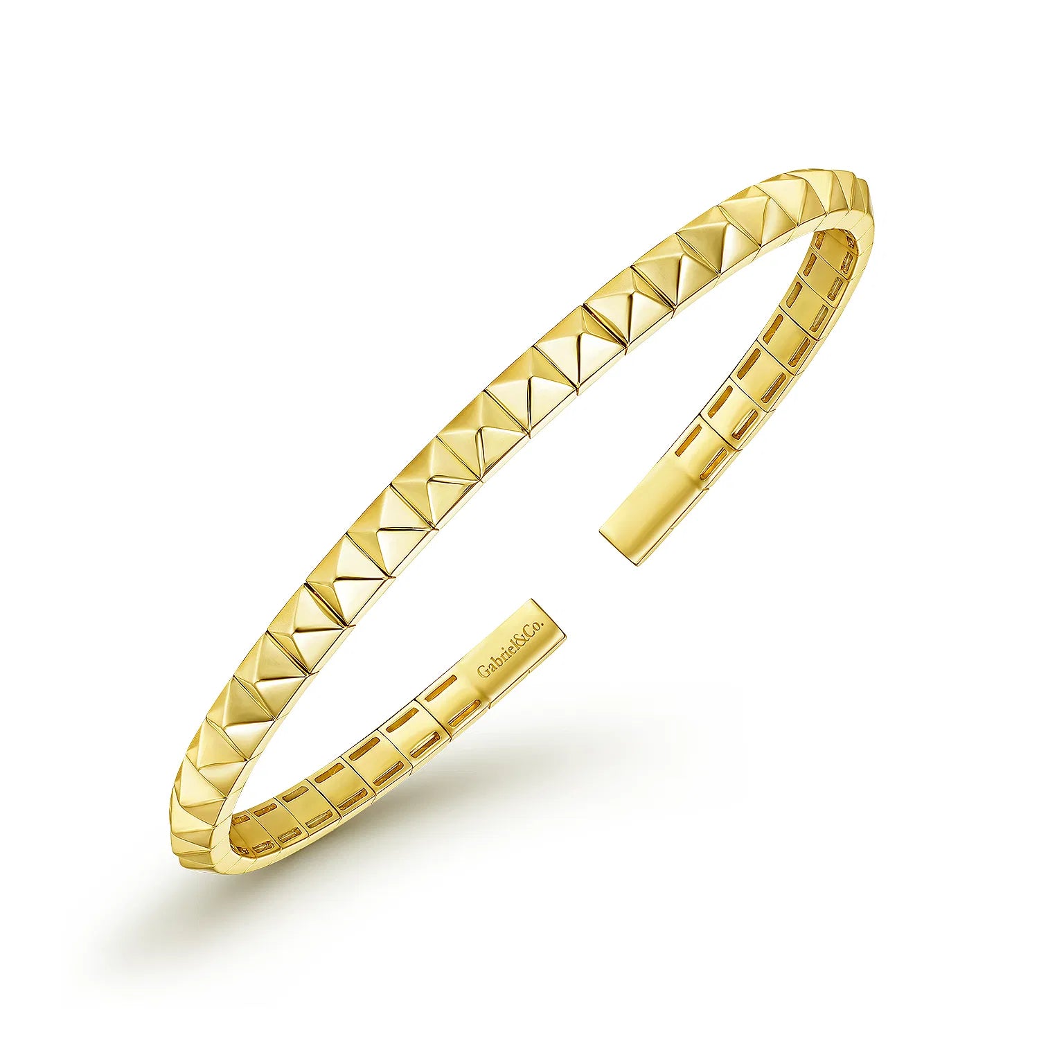 A 14K gold open cuff bracelet with a repeating faceted pyramid texture, shown on a clean white background. The brand name 'Gabriel' is engraved on the inner clasp.
