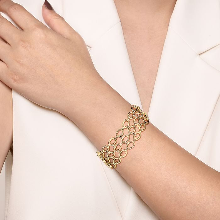 A 14K yellow gold hollow link chain bracelet designed by Gabriel & Co