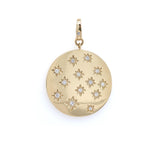 A 14K gold pendant with multiple star-shaped diamond designs