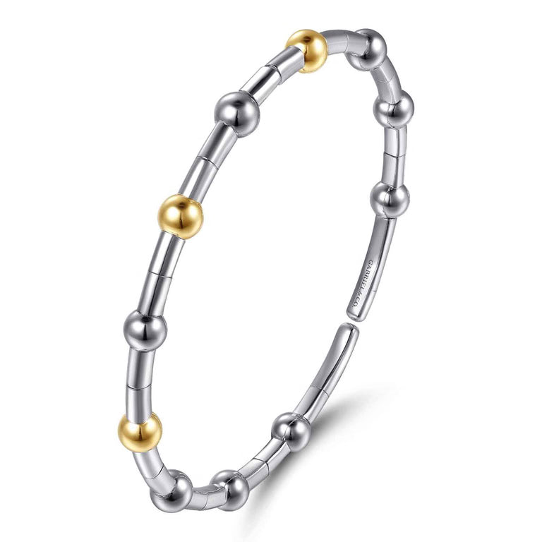 A two-tone metal beaded bracelet with sterling silver and 14K yellow gold beads shown on a clean white background.