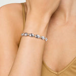 14k yg and sterling silver textured bangle on wrist 