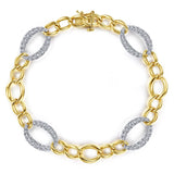 A 14K yellow gold chain bracelet with oval white gold links and pavé-set clear stones on alternating oval links, shown on a plain white background.