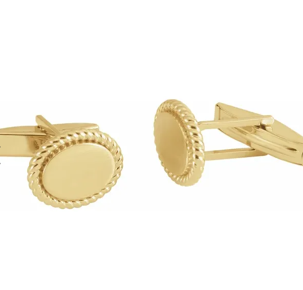A pair of 14K yellow gold rope pattern cufflinks with a polished finish.
