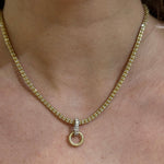 14k Gold necklace with Diaomond Baguette Bail Charm on a woman's neck