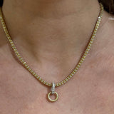 14k Gold necklace with Diaomond Baguette Bail Charm on a woman's neck