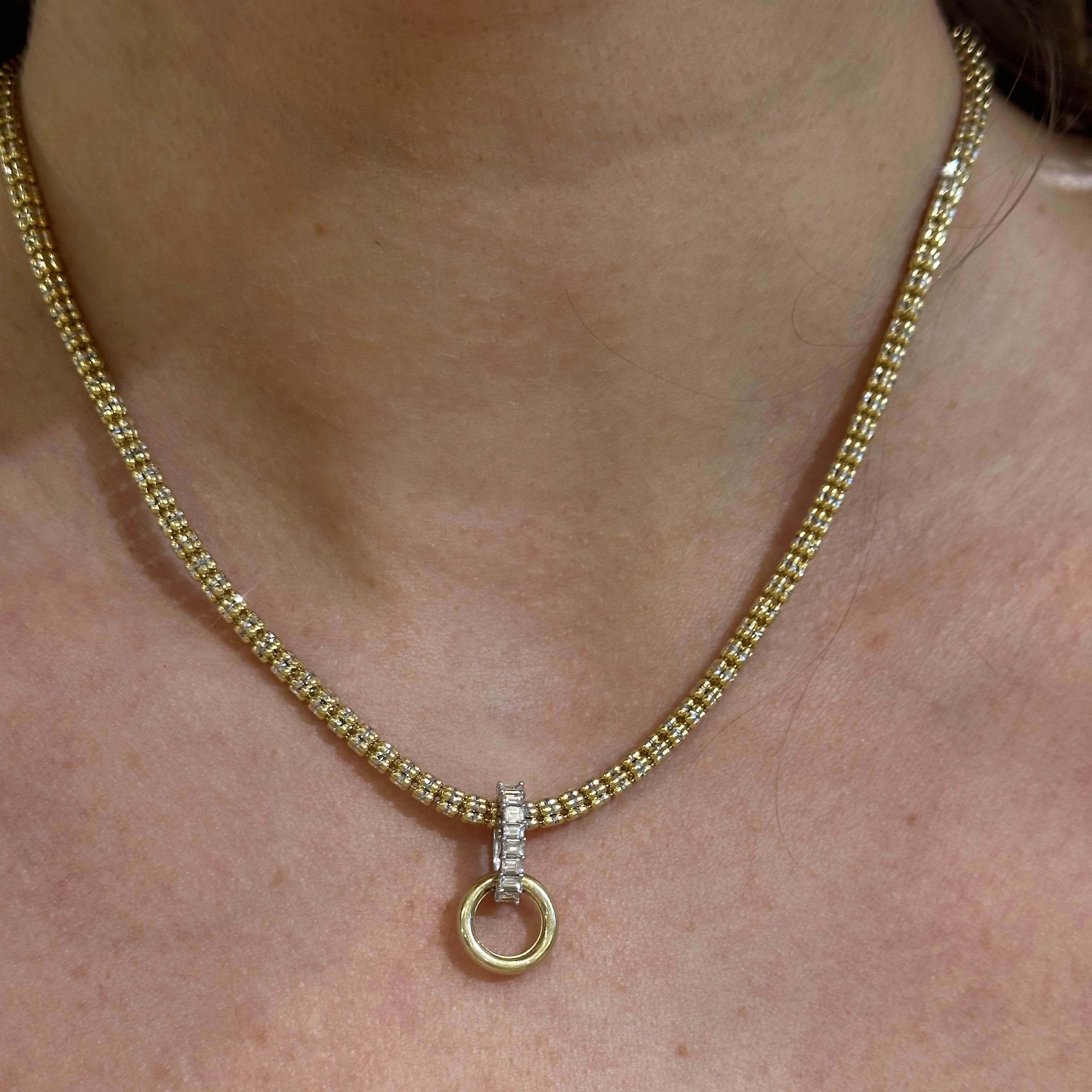 14k Gold necklace with Diaomond Baguette Bail Charm on a woman's neck