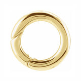 A polished 14K gold hinged circular bail to attach pendants to necklaces