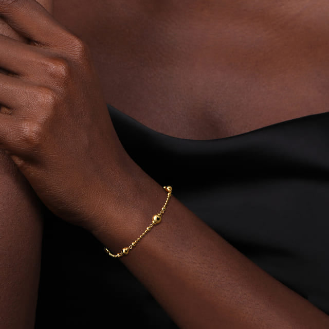 14K YG Gold Beaded Bujukan Bracelet on wrist