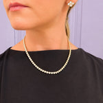 14K yellow gold bezel diamond tennis neckalace on model