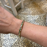 14K Yellow Gold Emerald & Diamond Scatter Bracelet on wrist 