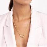 woman wearing 14K gold diamond barrel twist heart shaped necklace clasp