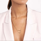 woman wearing 14K gold diamond barrel twist heart shaped necklace clasp
