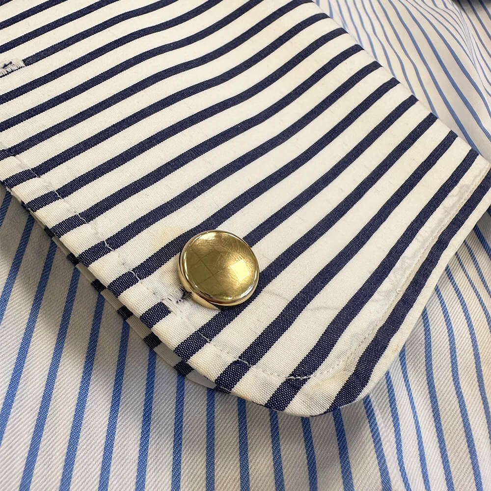 14K gold round button cufflinks on a shirt