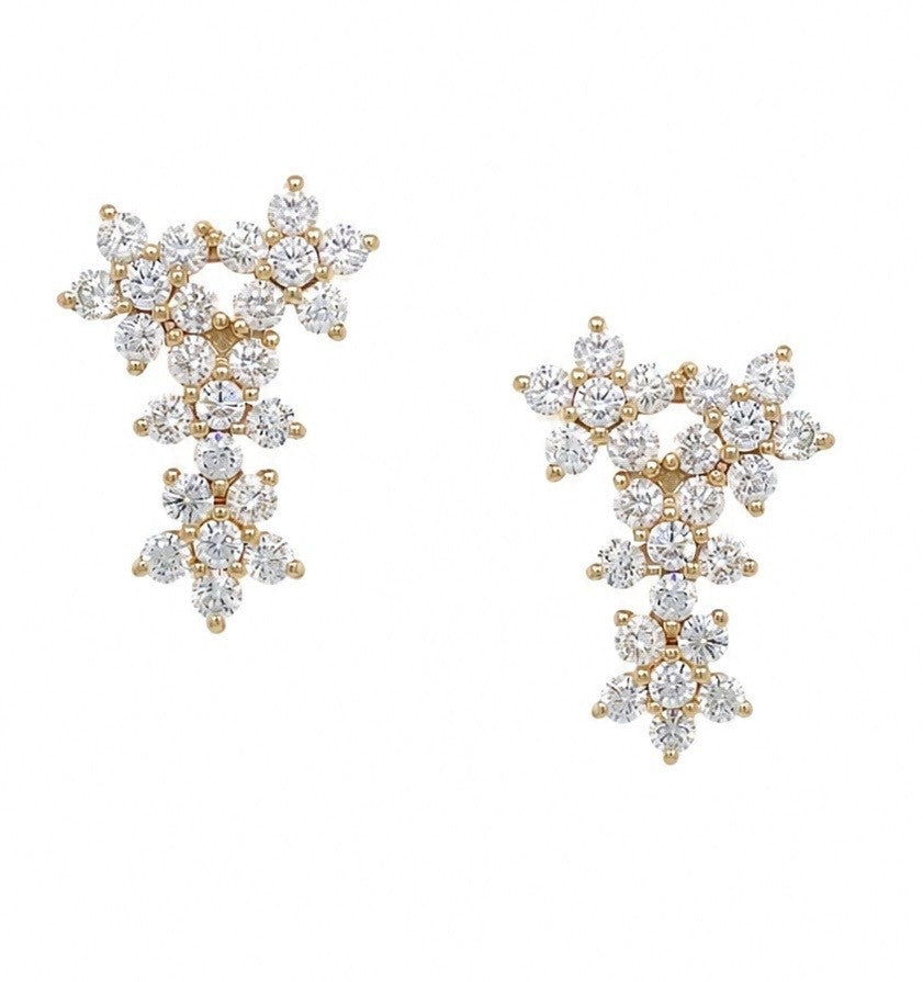 A pair of 14K gold and diamond ear climber earrings with a multi-stone floral cluster design, displayed on a clean white background.