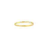A thin yellow gold band ring with diamond stations, displayed against a white background.