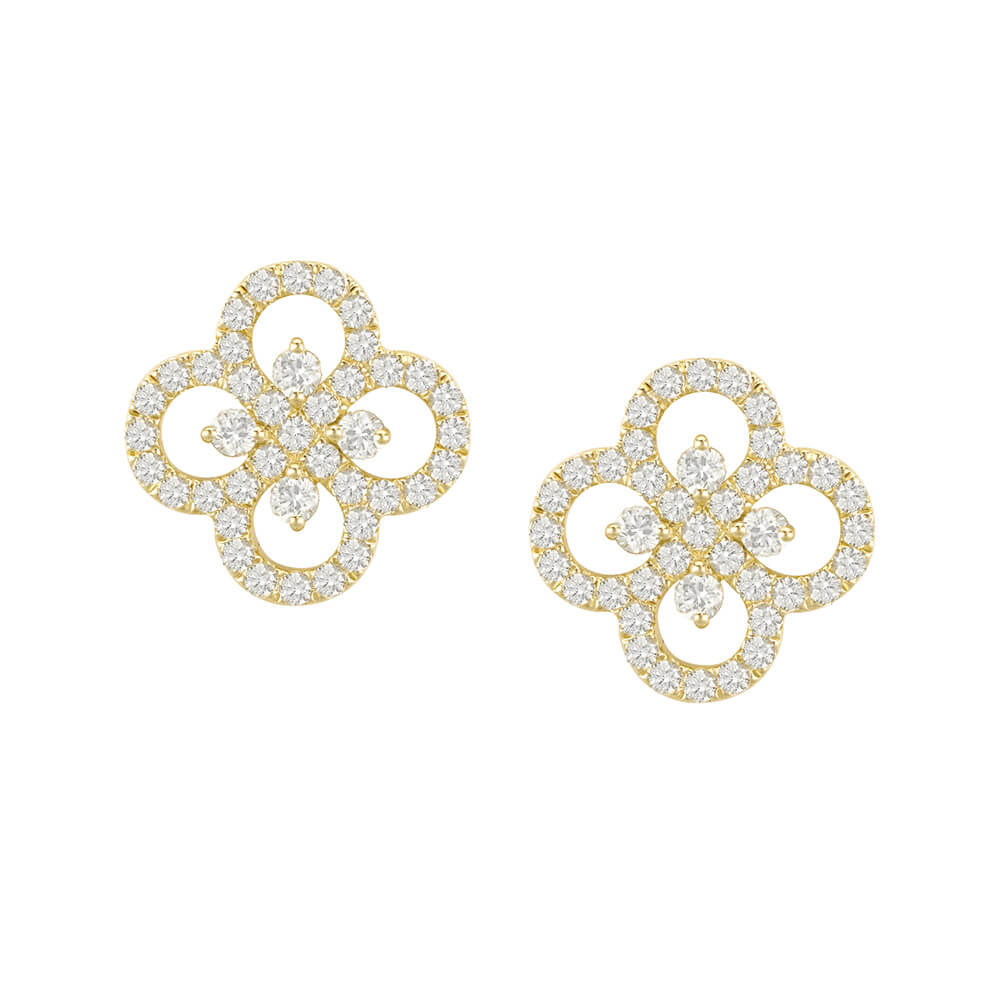 A pair of yellow gold and diamond earrings in a clover leaf design