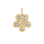 Gold flower-shaped pendant with embedded diamonds on a white background