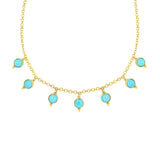 Gold necklace with turquoise stones on a white background